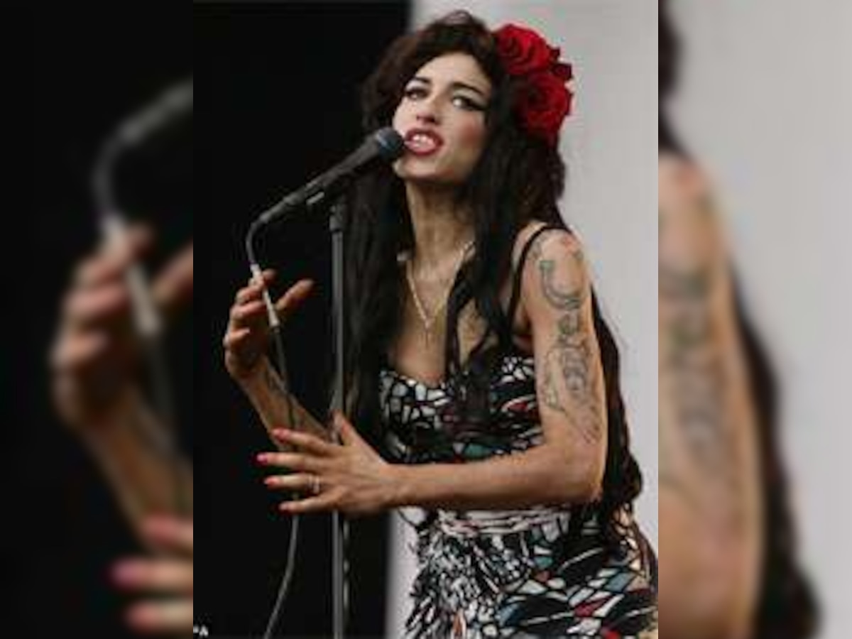 'Fed up Winehouse wants to settle down in home-like St.Lucia'