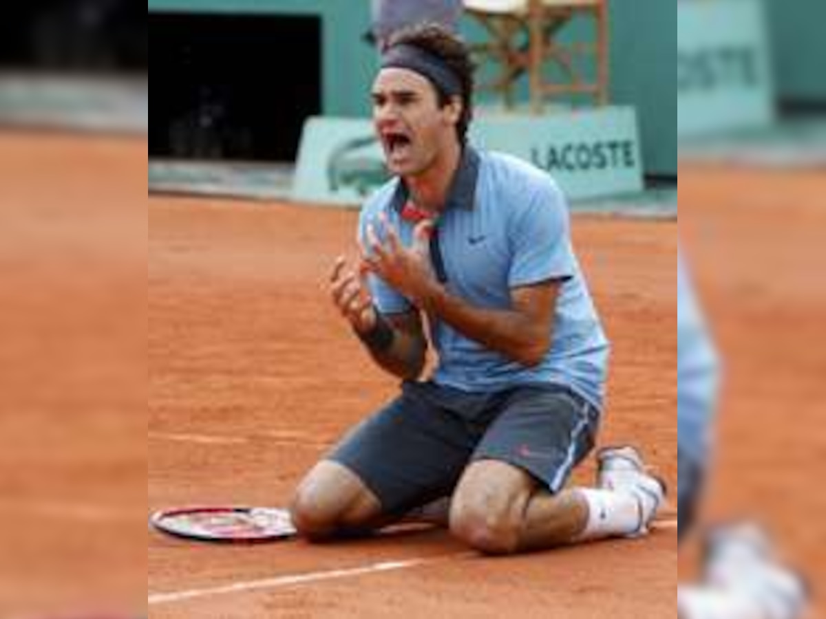 Inspired Roger Federer wins in Paris to complete slam