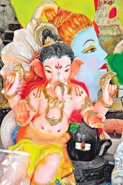 Parties pitch in with puja pandals