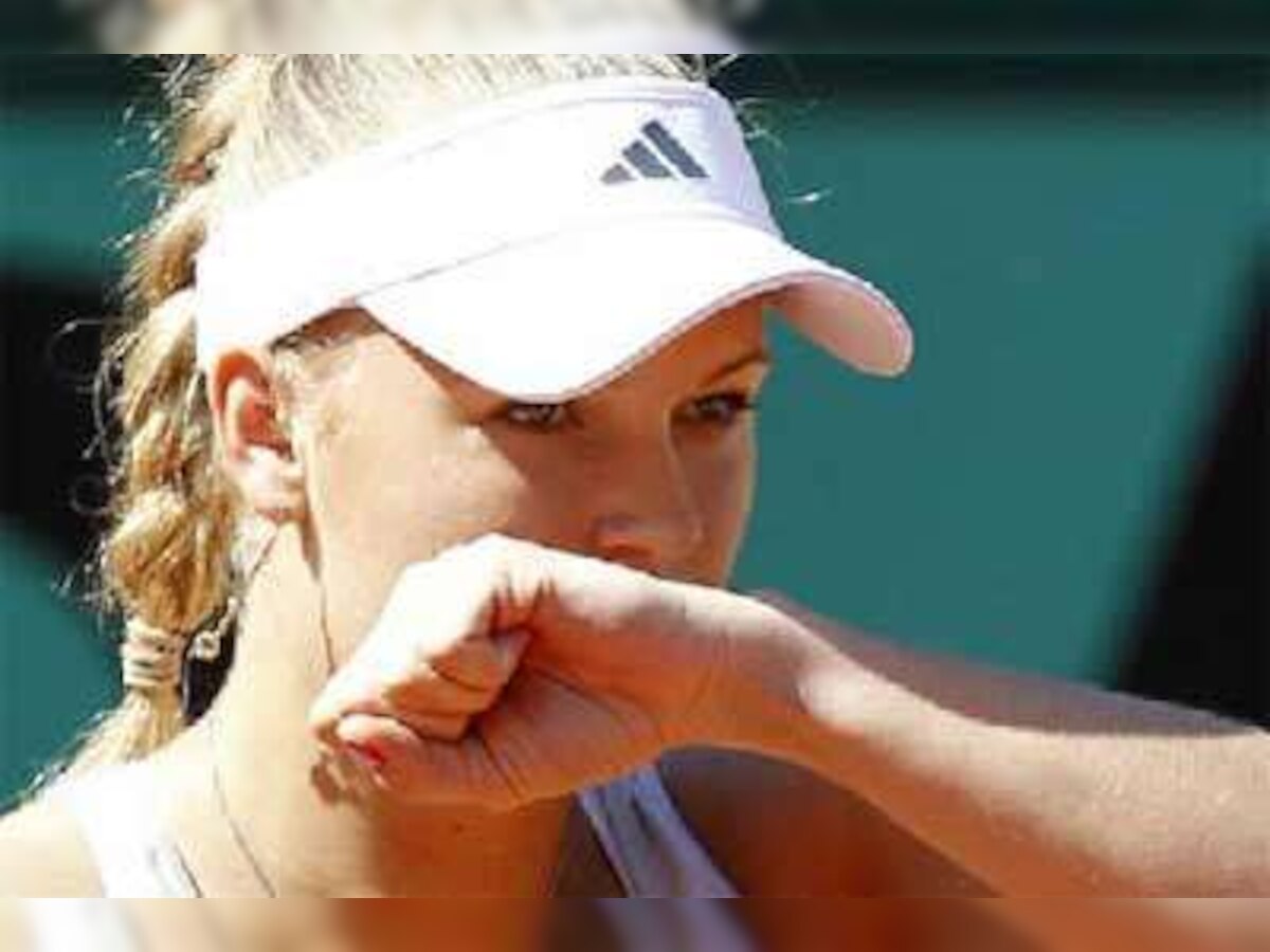 Caroline Wozniacki shrugs off injury to waltz through in Paris