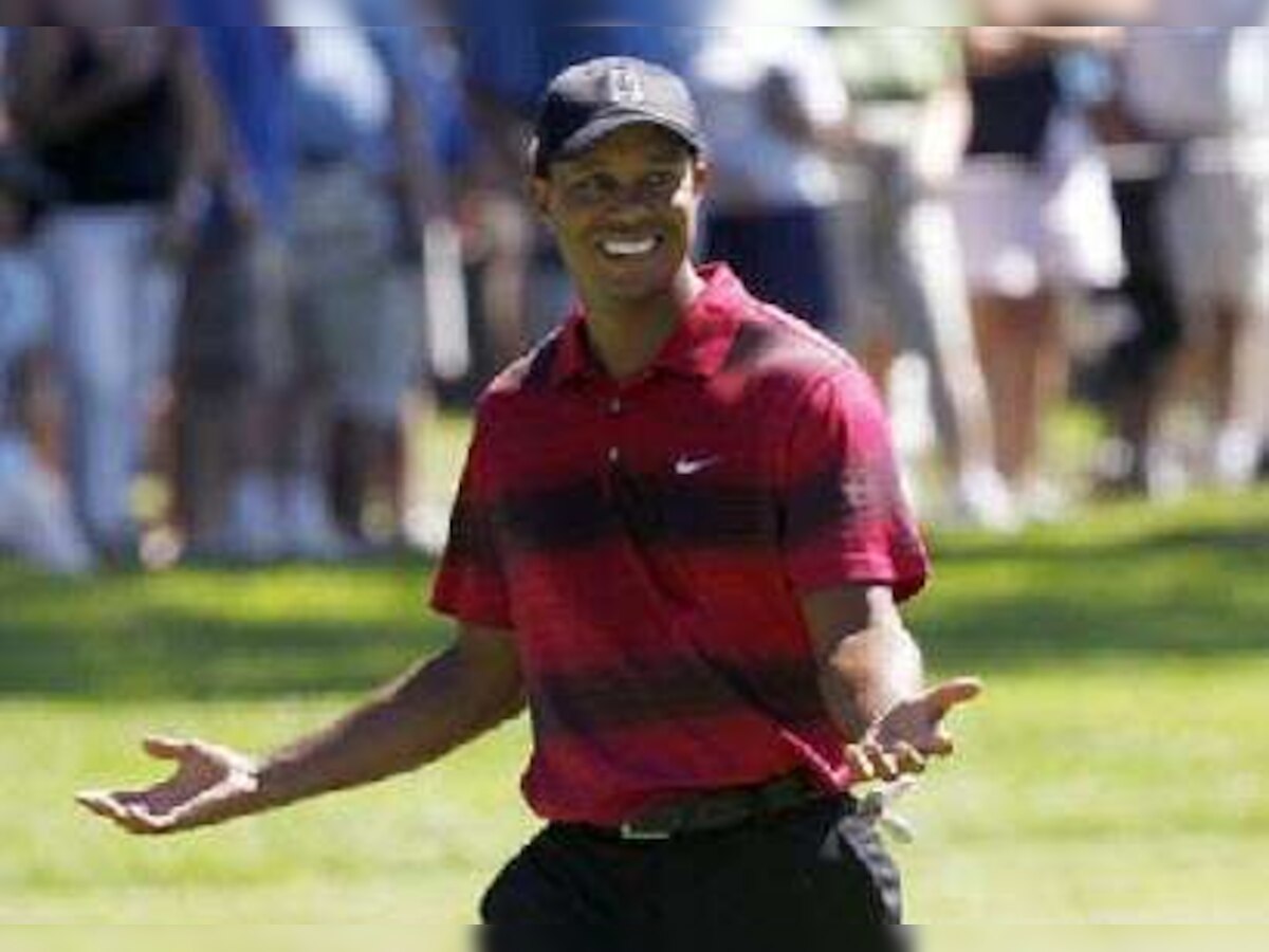 Tiger Woods smiled and posed for cameras right after divorce