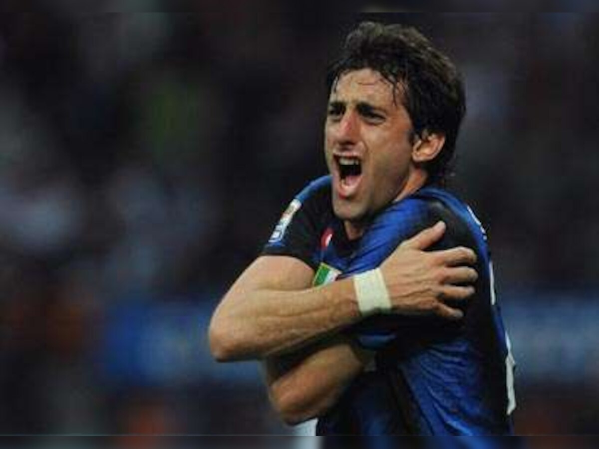 Inter Milan's Diego Milito and Esteban Cambiasso face spell on sidelines