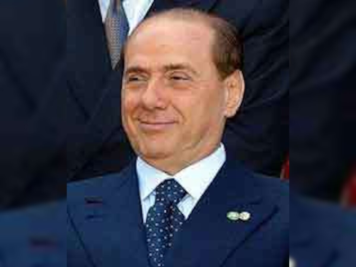 Silvio Berlusconi dismisses scandal, saying 'I love women'