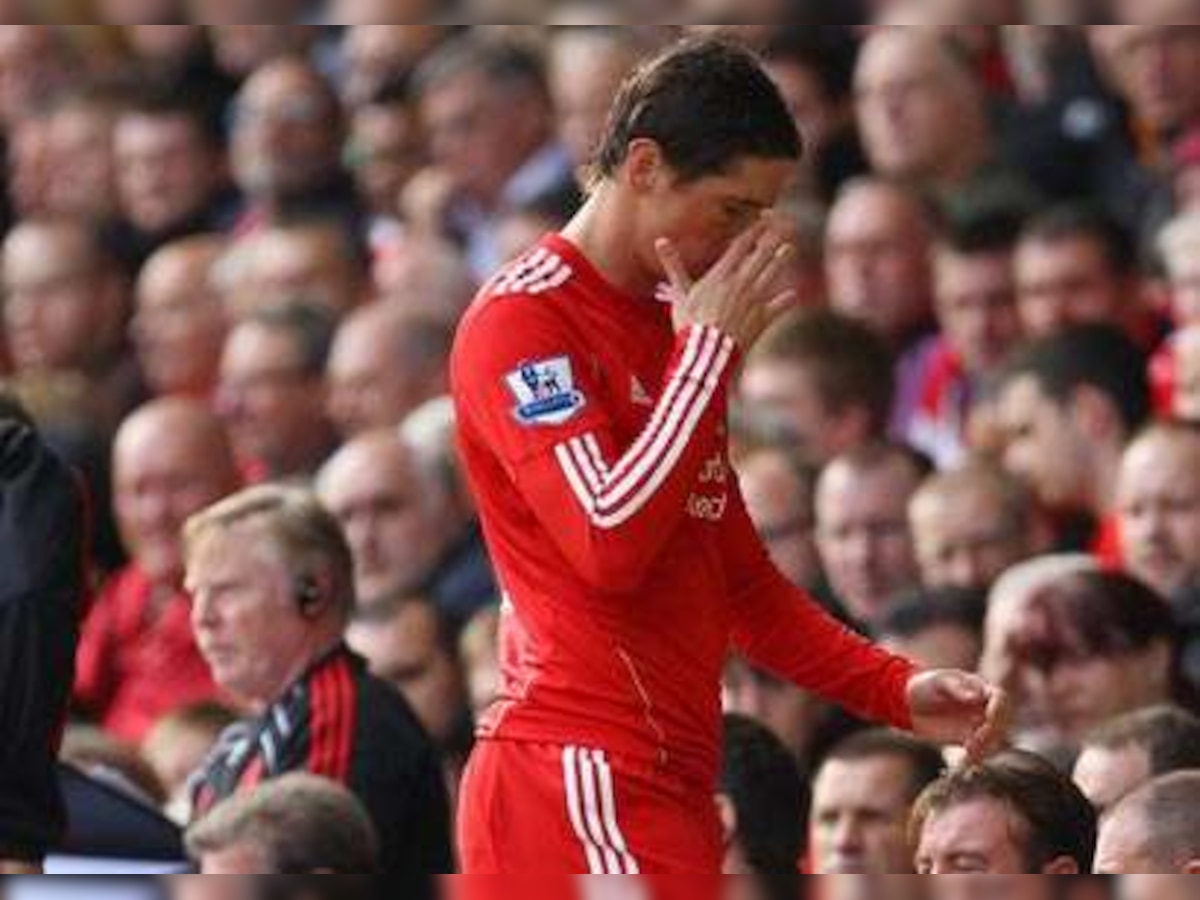 Liverpool's Fernando Torres suffers ankle damage; travels to Spain