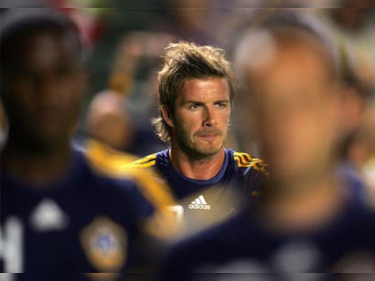 David Beckham denies affair with prostitute, sues US magazine