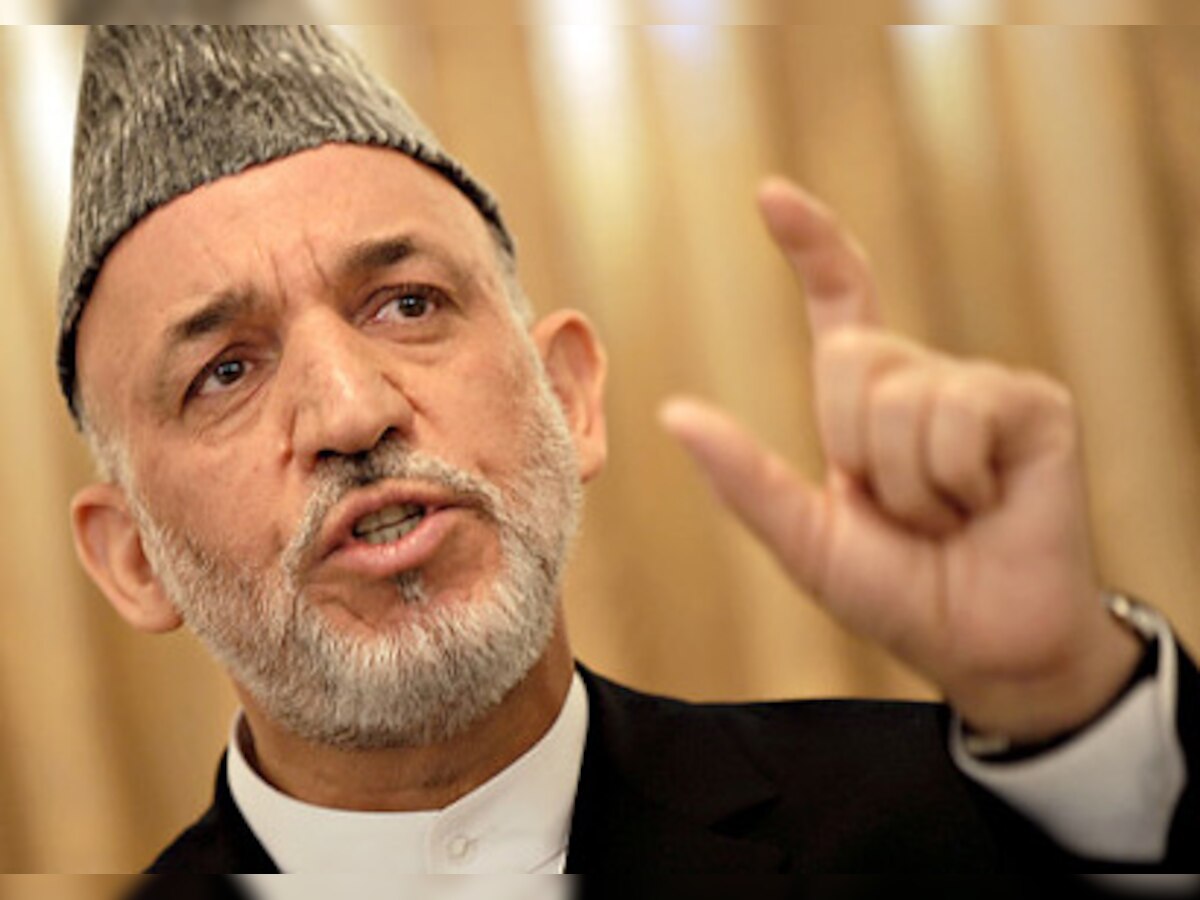 Afghan President Hamid Karzai in peace pledge at Burhanuddin Rabbani's funeral