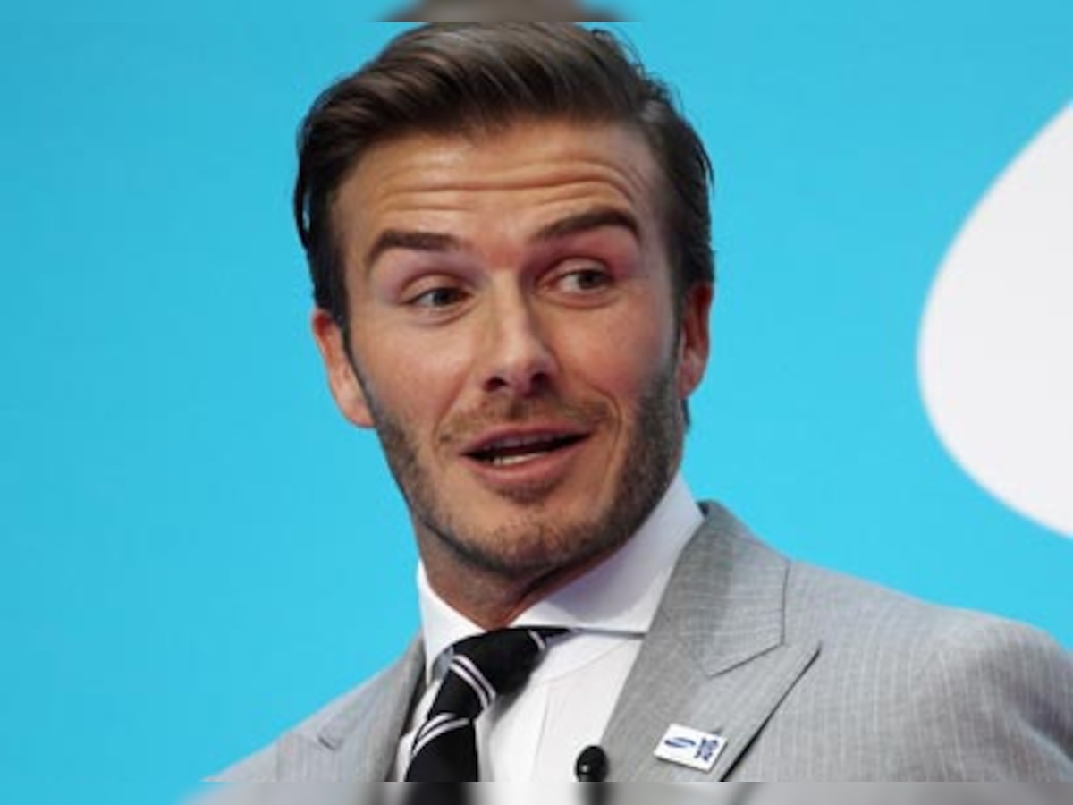 David Beckham rides motorbike in shirt and tie to meet Barack Obama