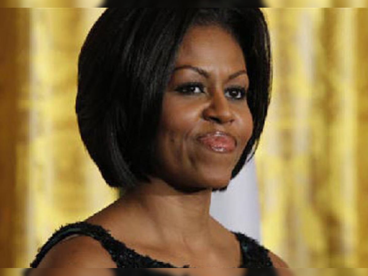 Michelle Obama says change takes time, urges four more years