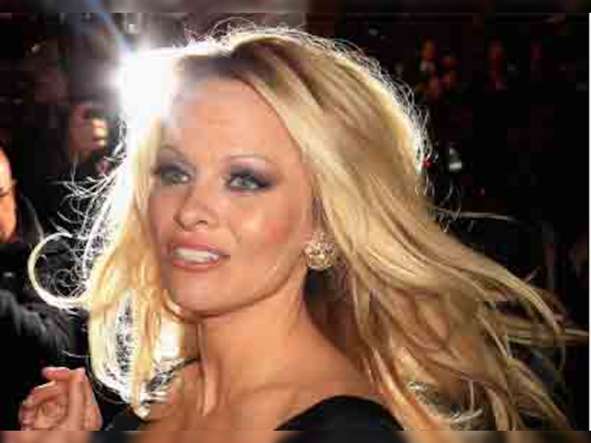 Pamela Anderson crashes out of Dance show as boobs fall out of