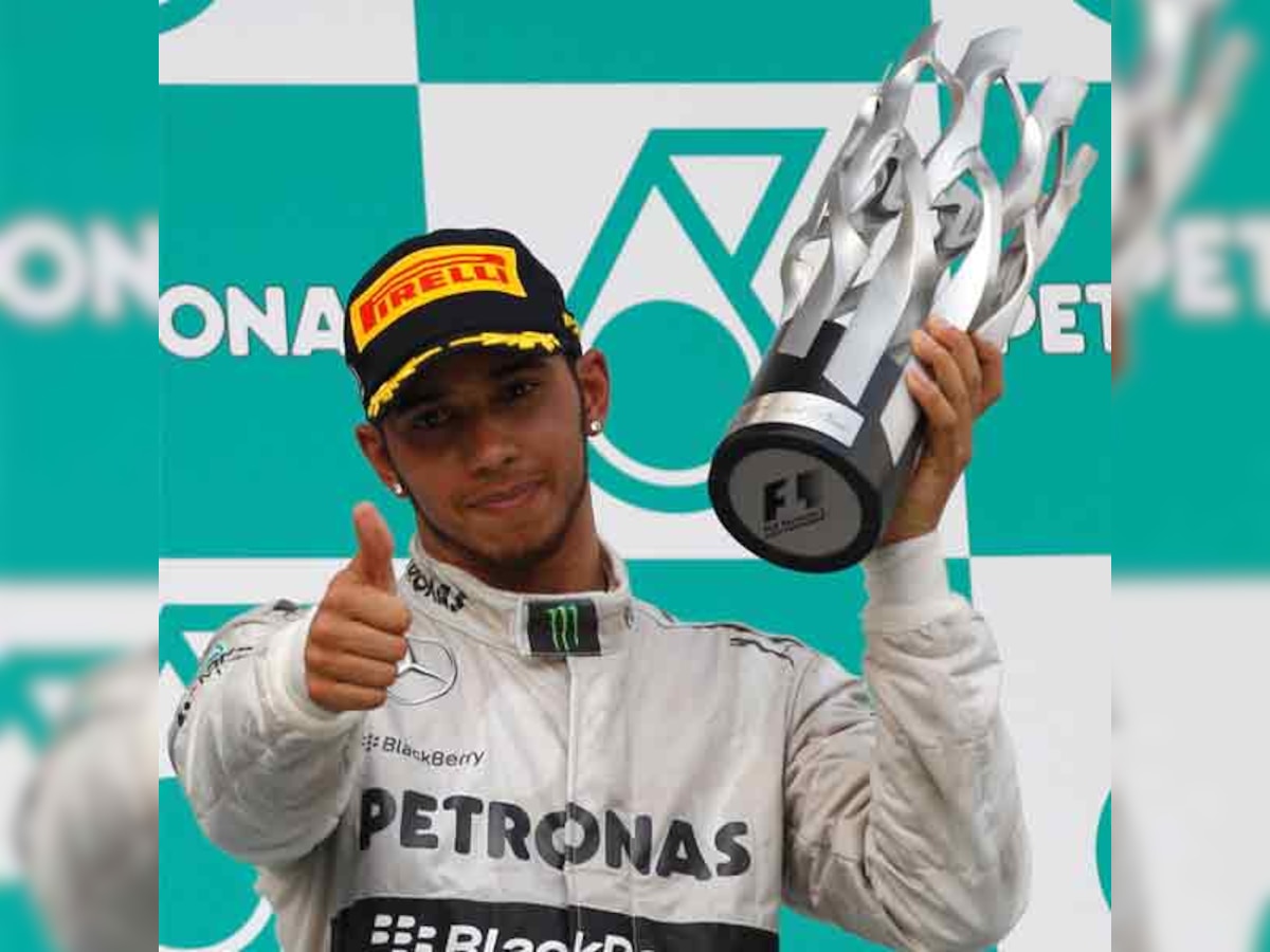 Lewis Hamilton makes a pit stop in old team McLaren's box