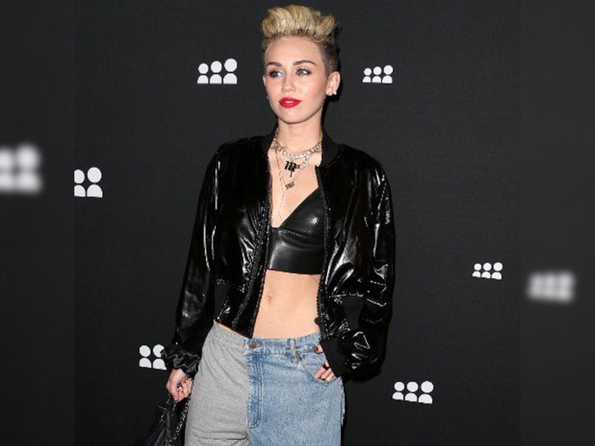 Miley Cyrus doing fine after parents' divorce but concerned about sister