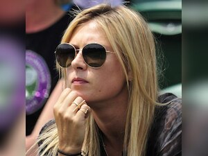 Maria Sharapova puts her loss behind her as she steps out to support boyfriend Grigor Dimitrov at Wimbledon