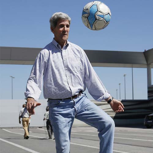 John Kerry shows off his football moves as his plane refuelled at ...