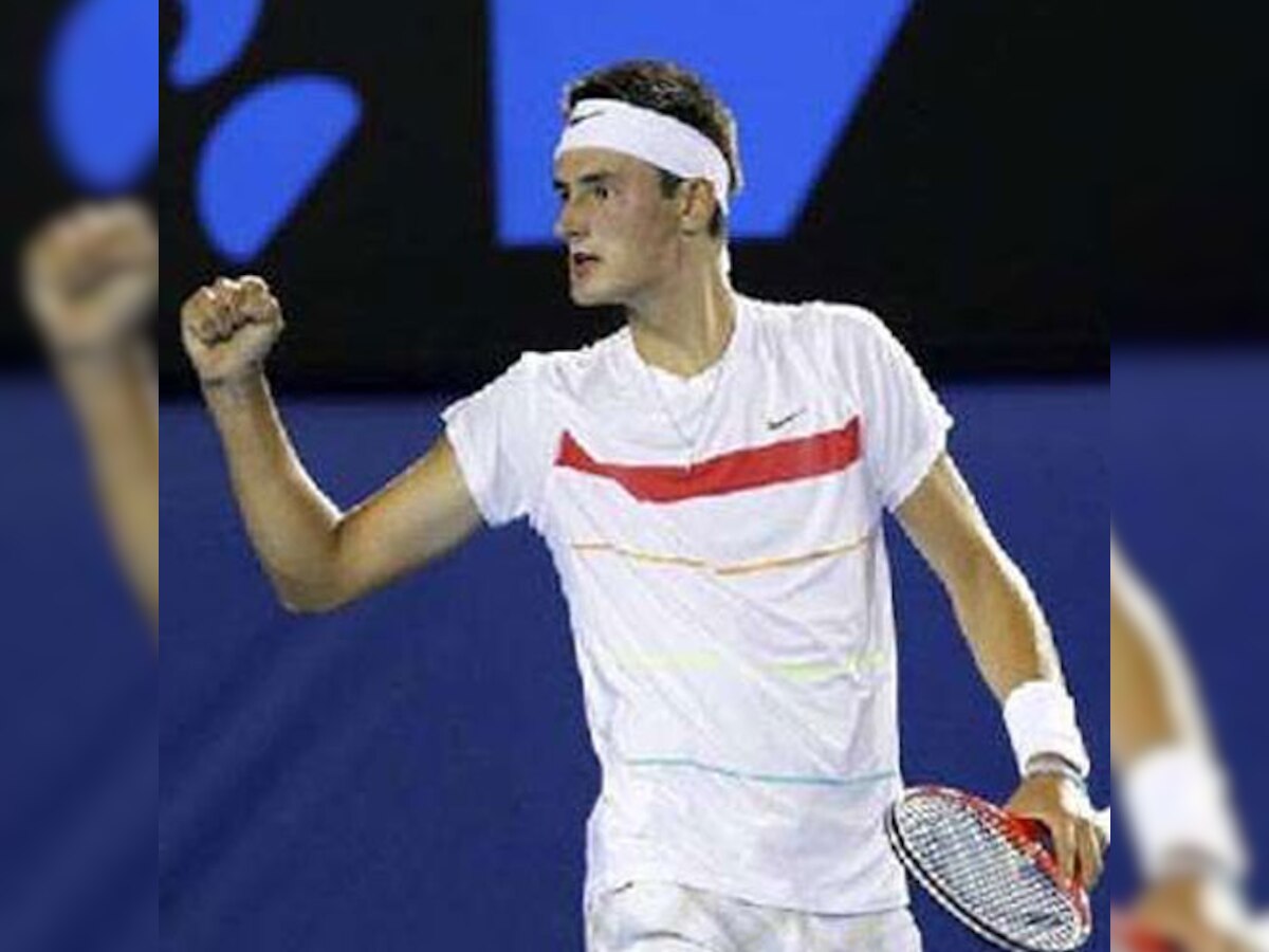 Bernard Tomic steers Australia back into Davis Cup World Group after six years