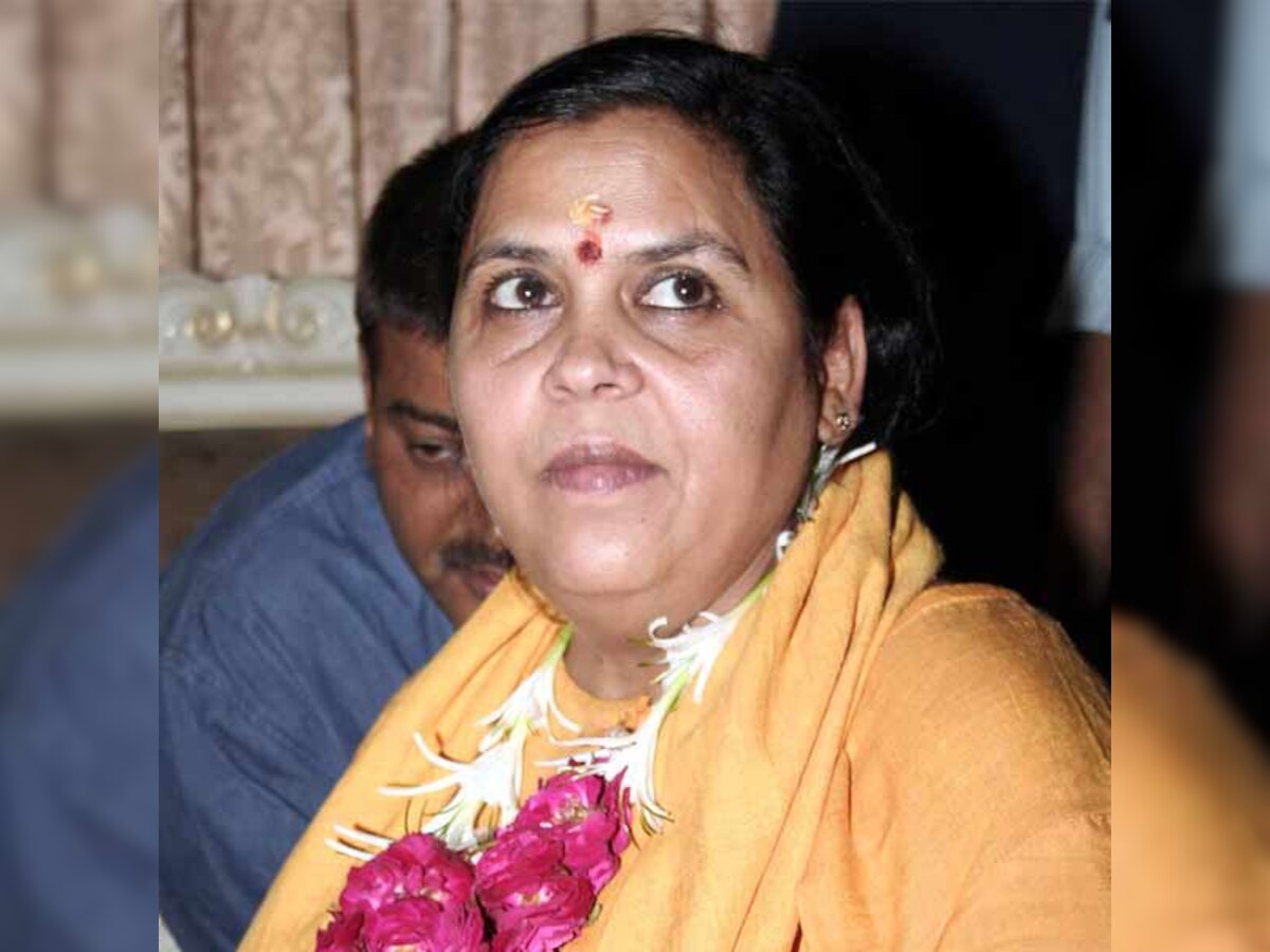 Uma Bharti prevented from going to Muzaffarnagar, sits on dharna