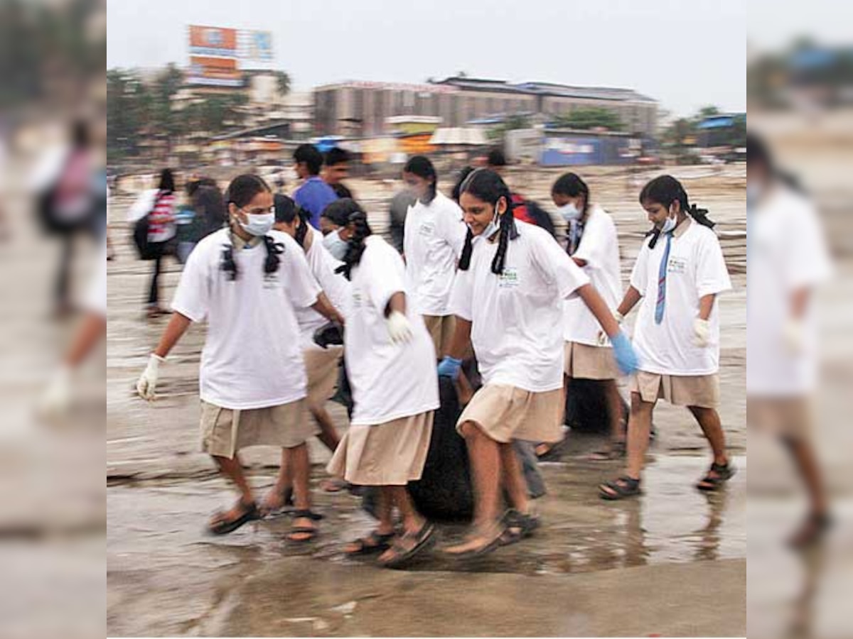 Day after immersion, students sweep beaches clean