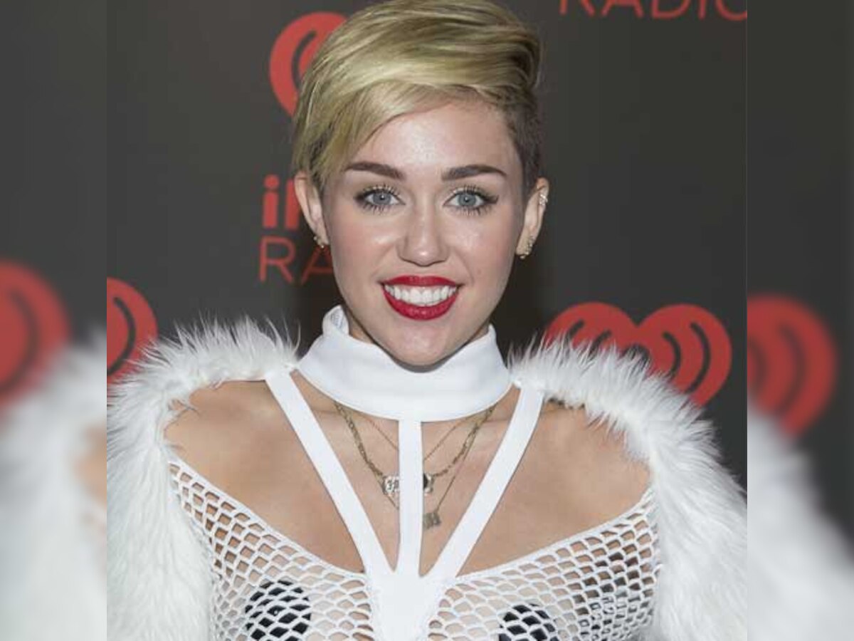 Miley Cyrus cosies up to music producer Mike WiLL Made It in racy pics