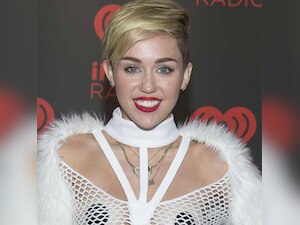 Miley Cyrus cosies up to music producer Mike WiLL Made It in racy pics