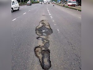 Woman fights for life, mother blames pothole