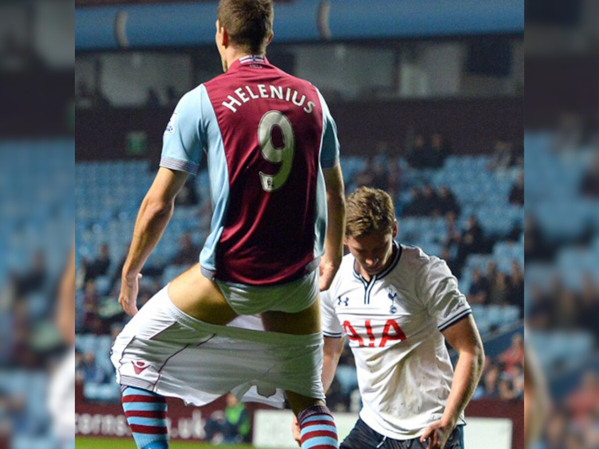 Spurs player Jan Vertonghen pulls down shorts of Aston Villa striker Nicklas Helenius in League Cup game
