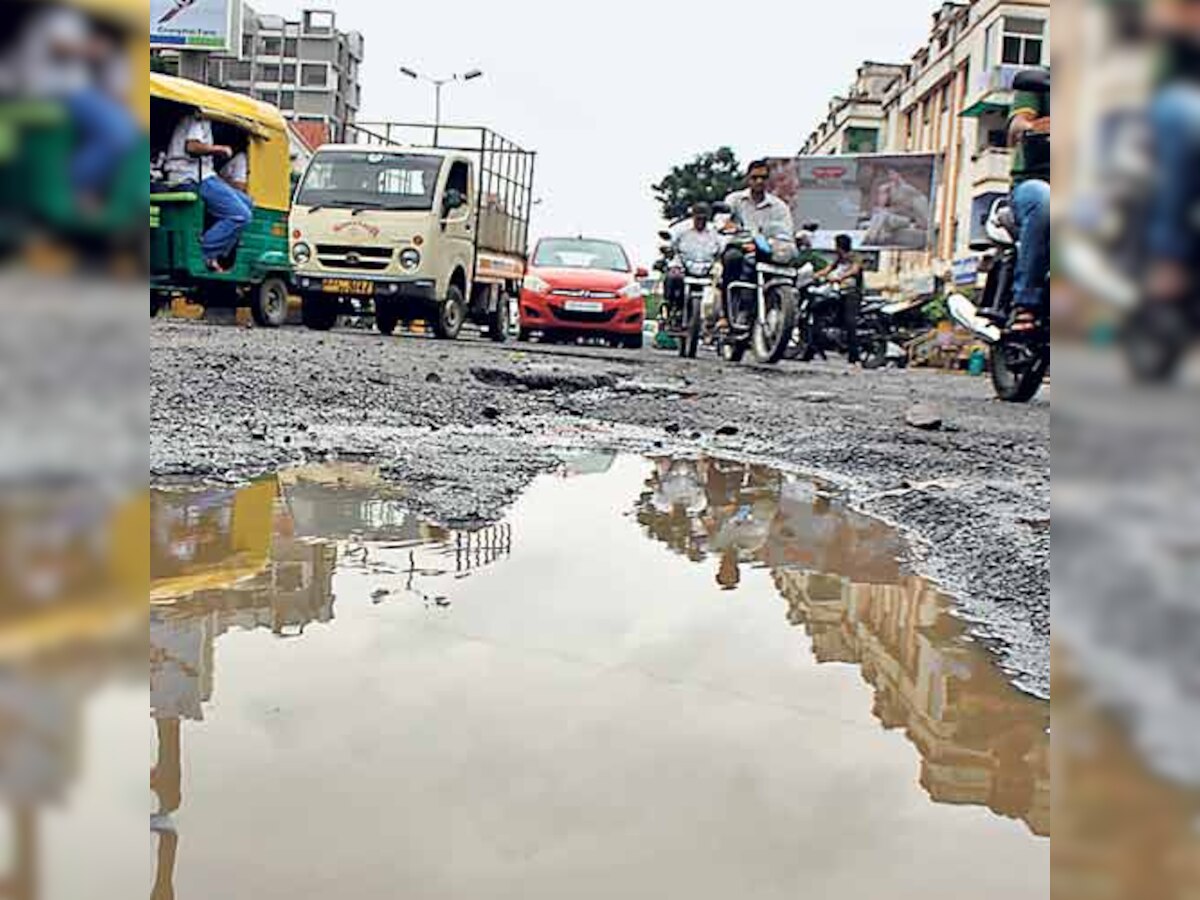 Yawning potholes and pits riddle Ahmedabad roads