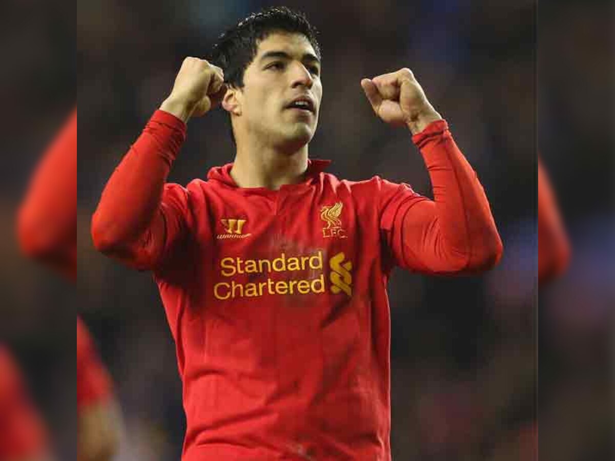 Luis Suarez hat-trick keeps Liverpool on Arsenal's tail