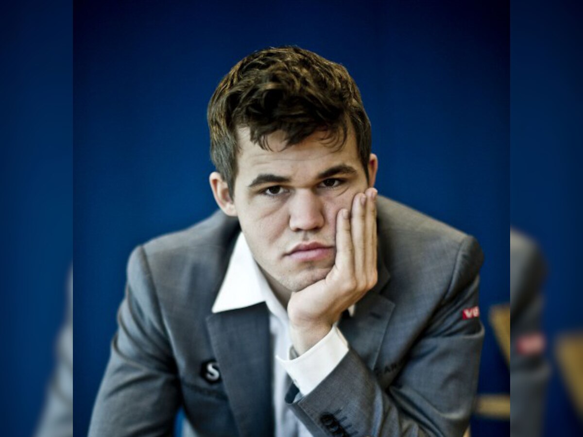 Magnus Carlsen wins ninth game, half point away from becoming champion