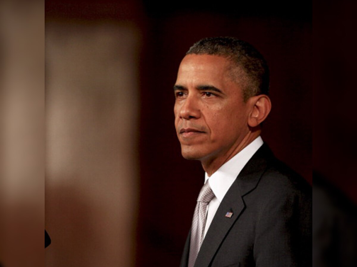 Barack Obama shakes hand of Cuba's Raul Castro at Nelson Mandela memorial