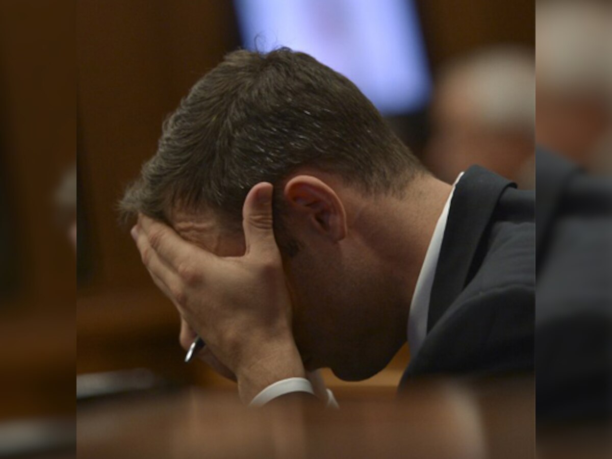 Oscar Pistorius 'covered eyes' after 'bloody' photos displayed during murder trial