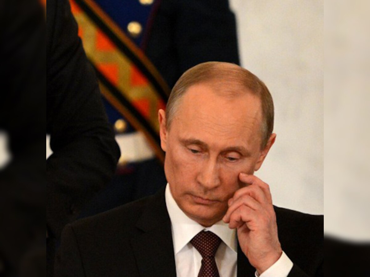 Vladimir Putin signs Crimea treaty as Ukraine serviceman dies in attack