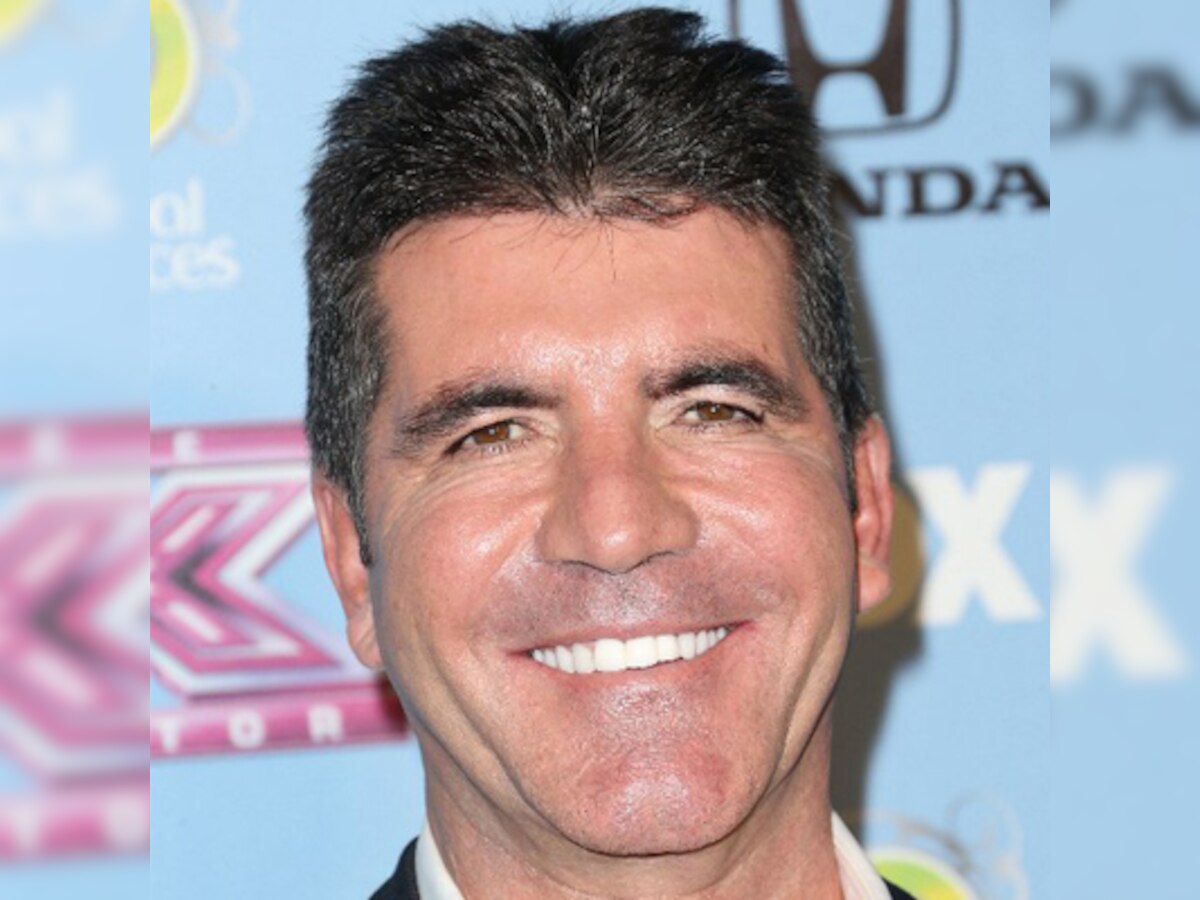 Simon Cowell's lover's ex-hubby opens up about losing her to him