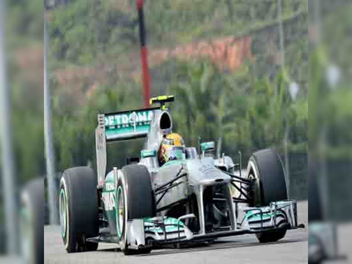 Flight MH370 crash casts dark shadow over upcoming Malaysian Grand Prix as teams arrive