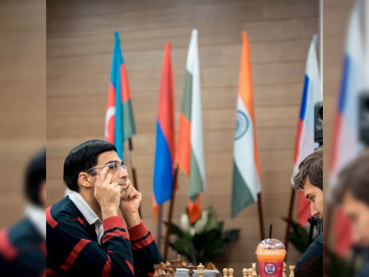 Viswanathan Anand draws with Sergey Karkajin to win Chess Candidates; sets up world title clash against Magnus Carlsen