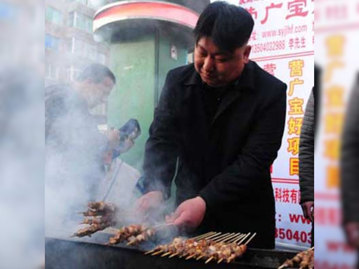 Is that notorious dictator Kim Jong-Un selling kebabs on the streets in China?