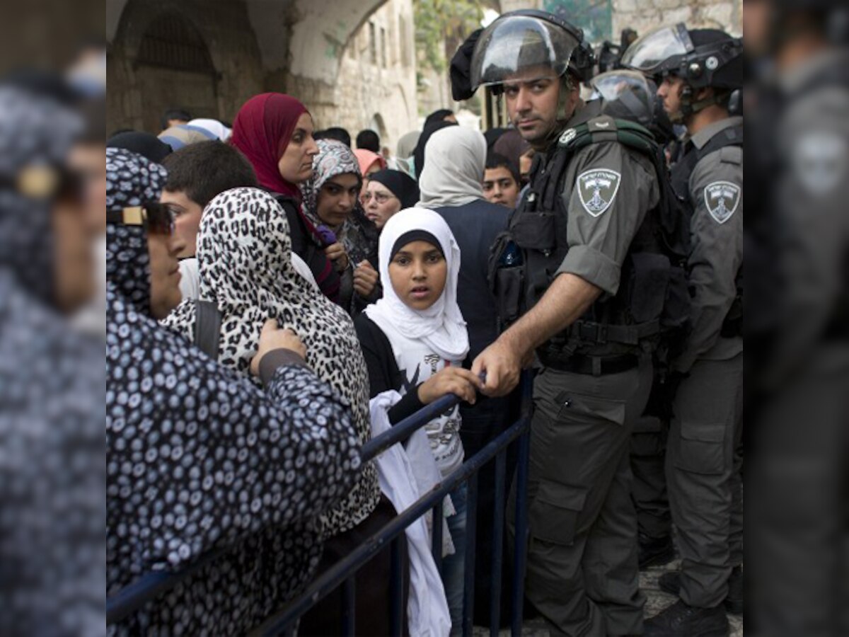 Israel police deny top Palestinian cleric accusation that they threw stun grenades into al Aqsa mosque