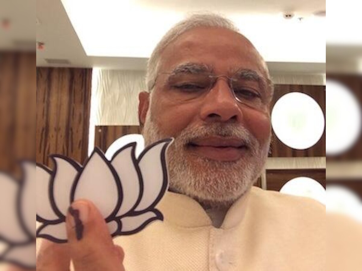 Narendra Modi flashes party symbol, Congress demands FIR against Gujarat CM