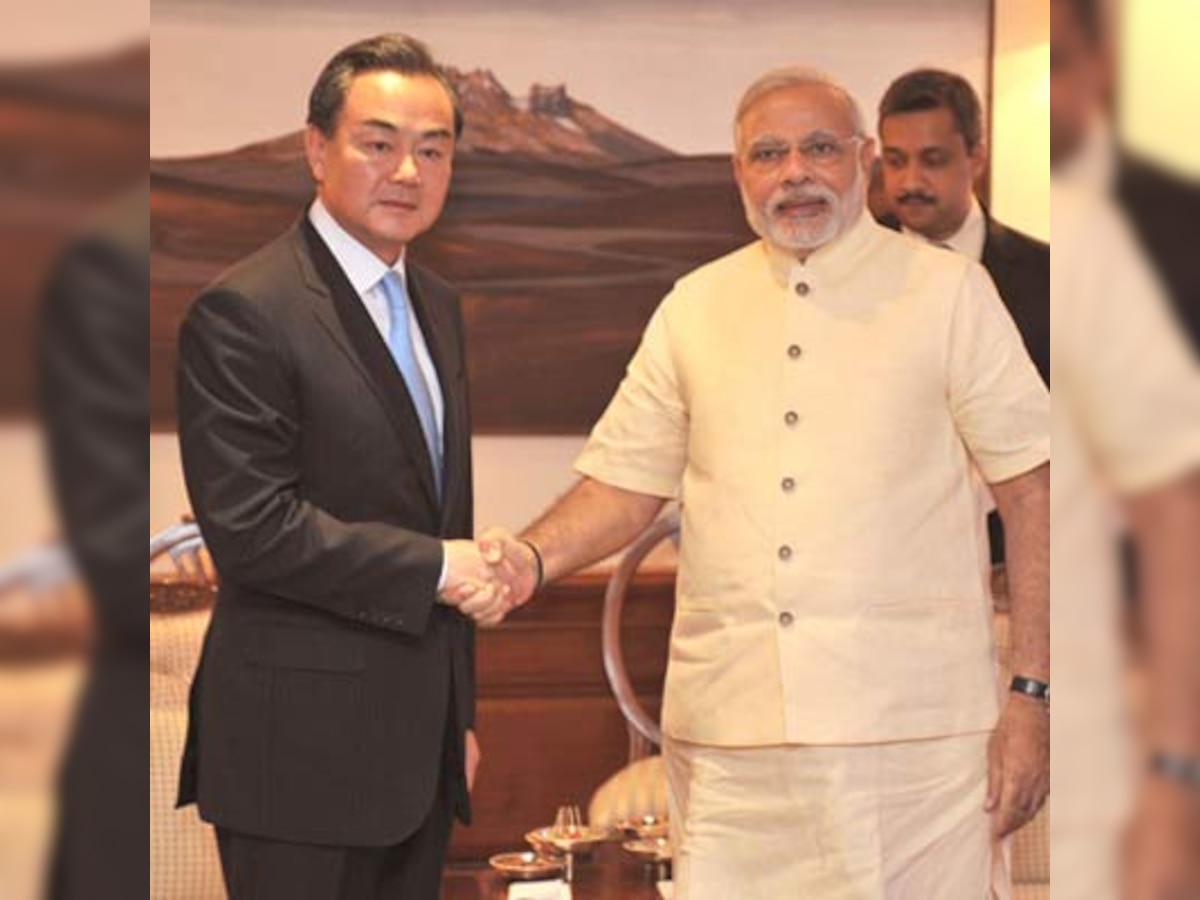 Chinese Foreign Minister Wang Yi seeks Narendra Modi's company to dominate the world