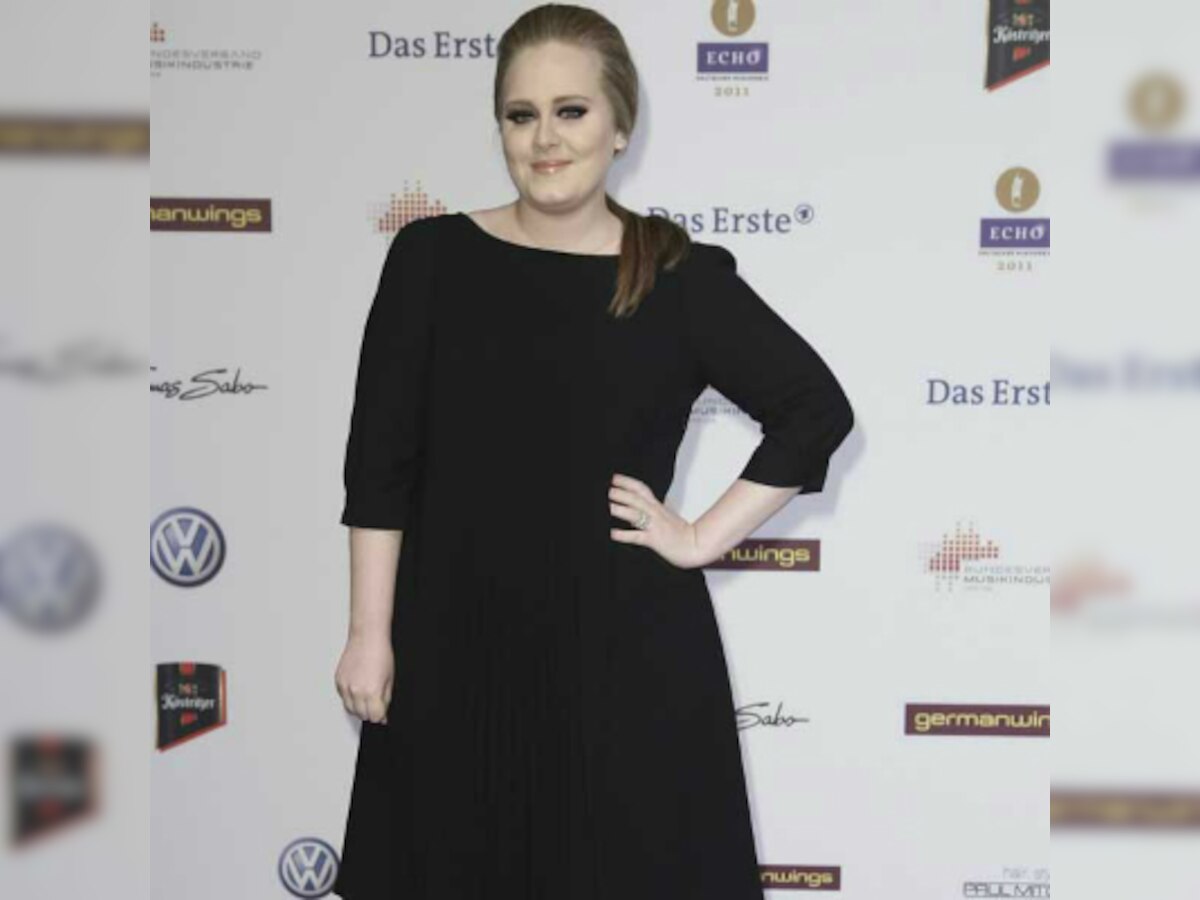 Adele wins case over son`s paparazzi photos