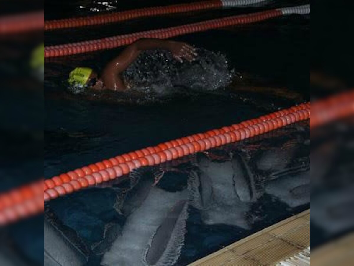 Onlookers amazed as champion swimmer spends hours in frigid water