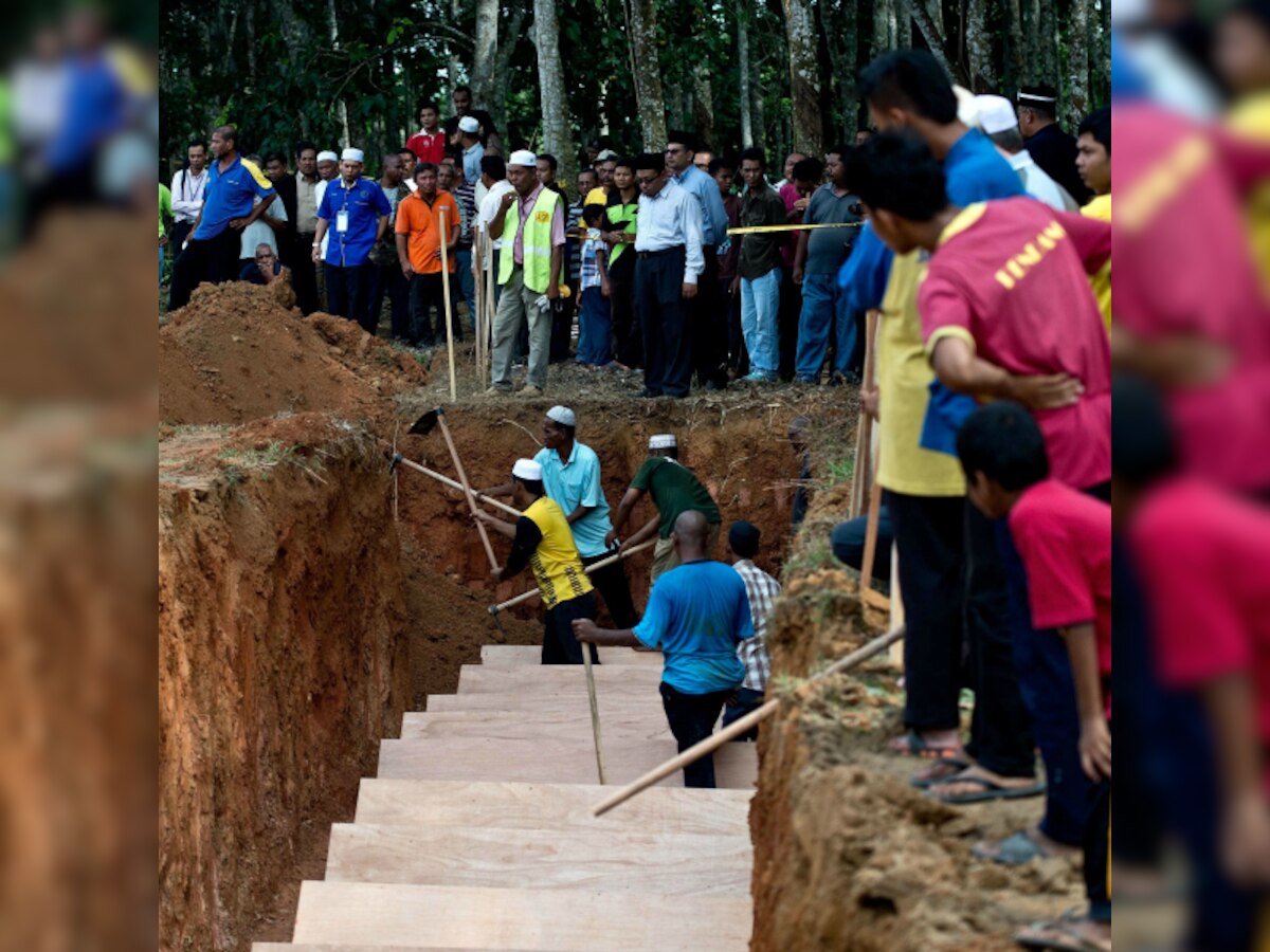 Malaysia bids sombre farewell to nameless Rohingya dead