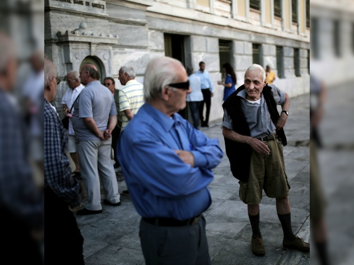 Pensioners queue outside Greek banks amid withdrawal limits