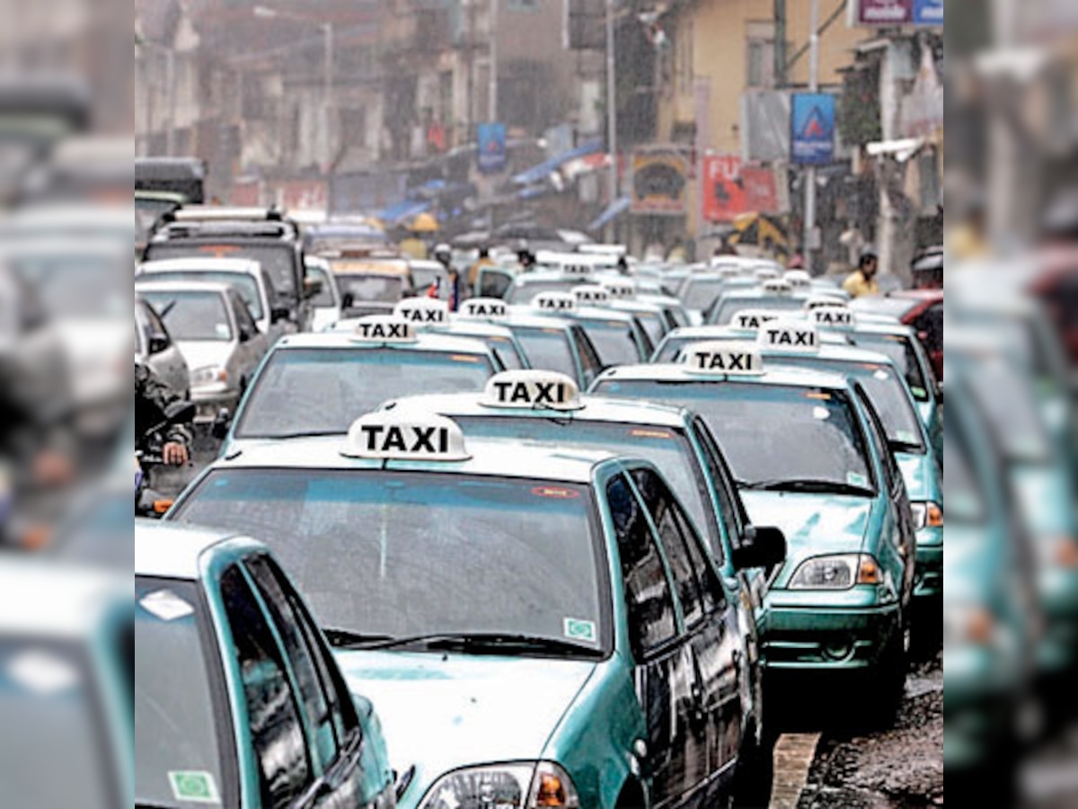 Delhi: Radio taxi catches fire with woman inside