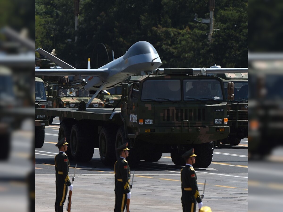 China puts on huge show of force at parade; President Xi Jinping says troop levels will be cut by 300,000