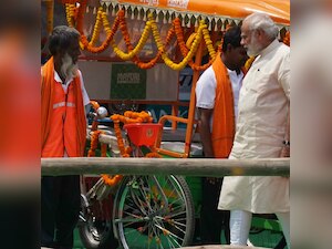 Varanasi: PM Modi distributes E-rickshaws and cheques among poor