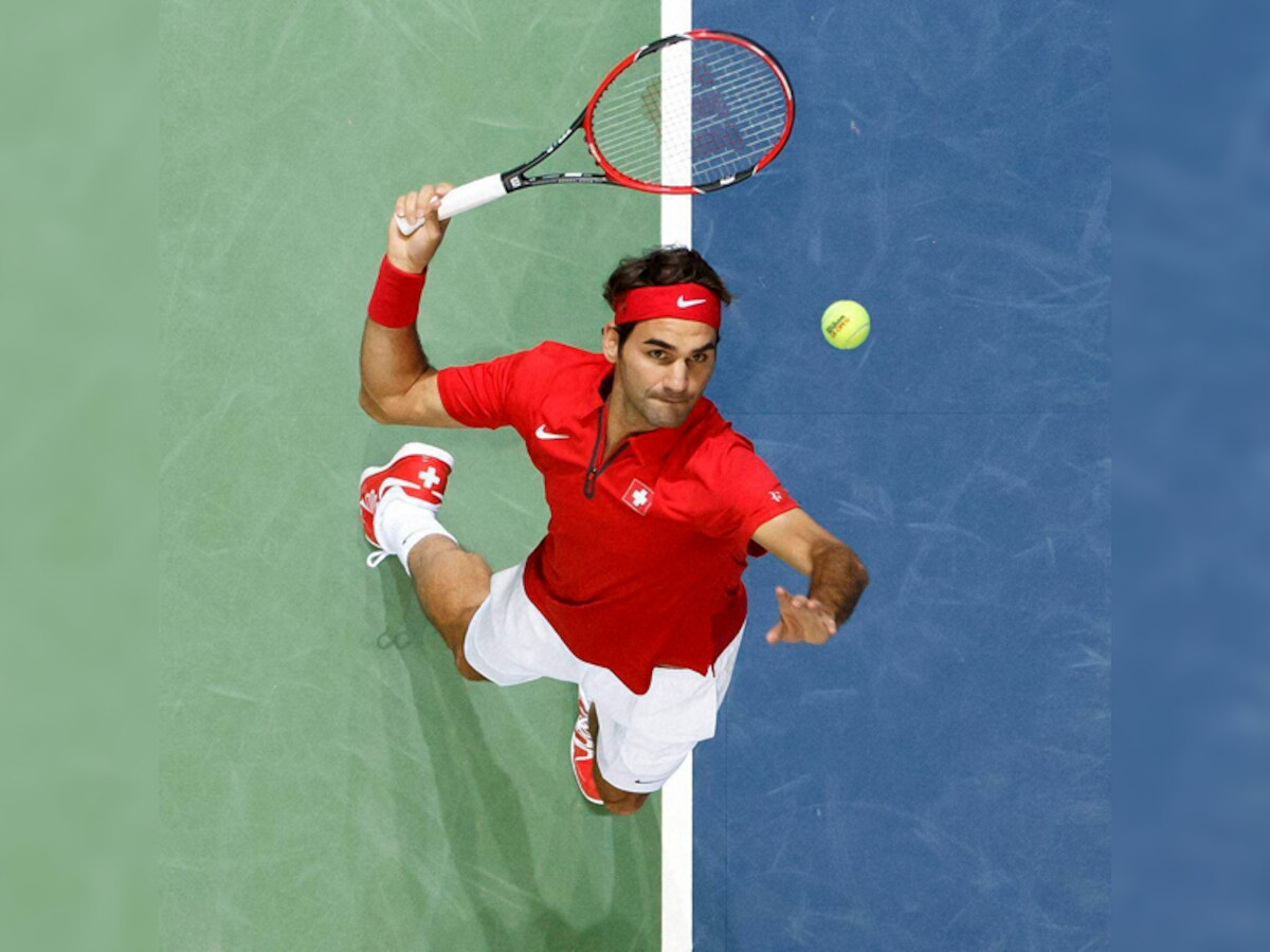 Davis Cup: Roger Federer helps Swiss win but coy about coming back next year