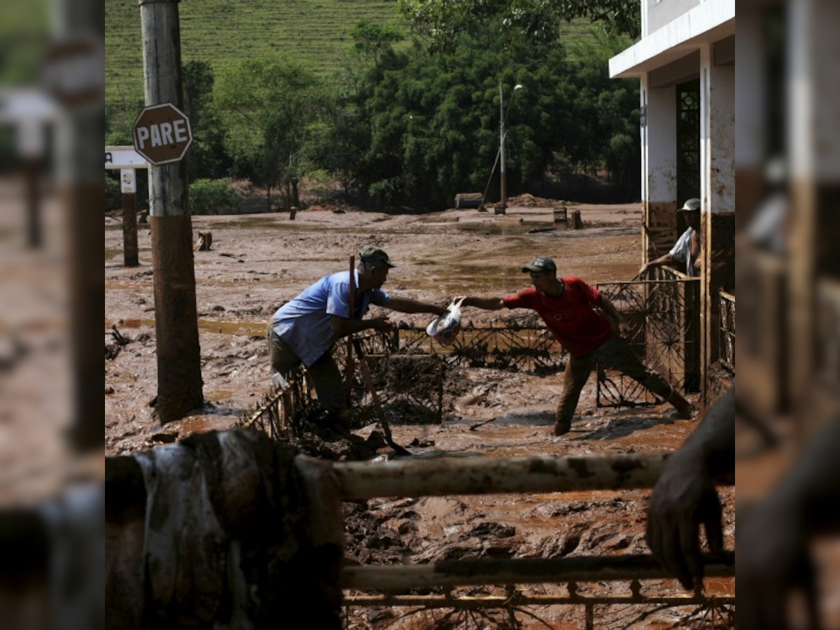 Two dozen missing in vast mudflow of Brazil mine disaster