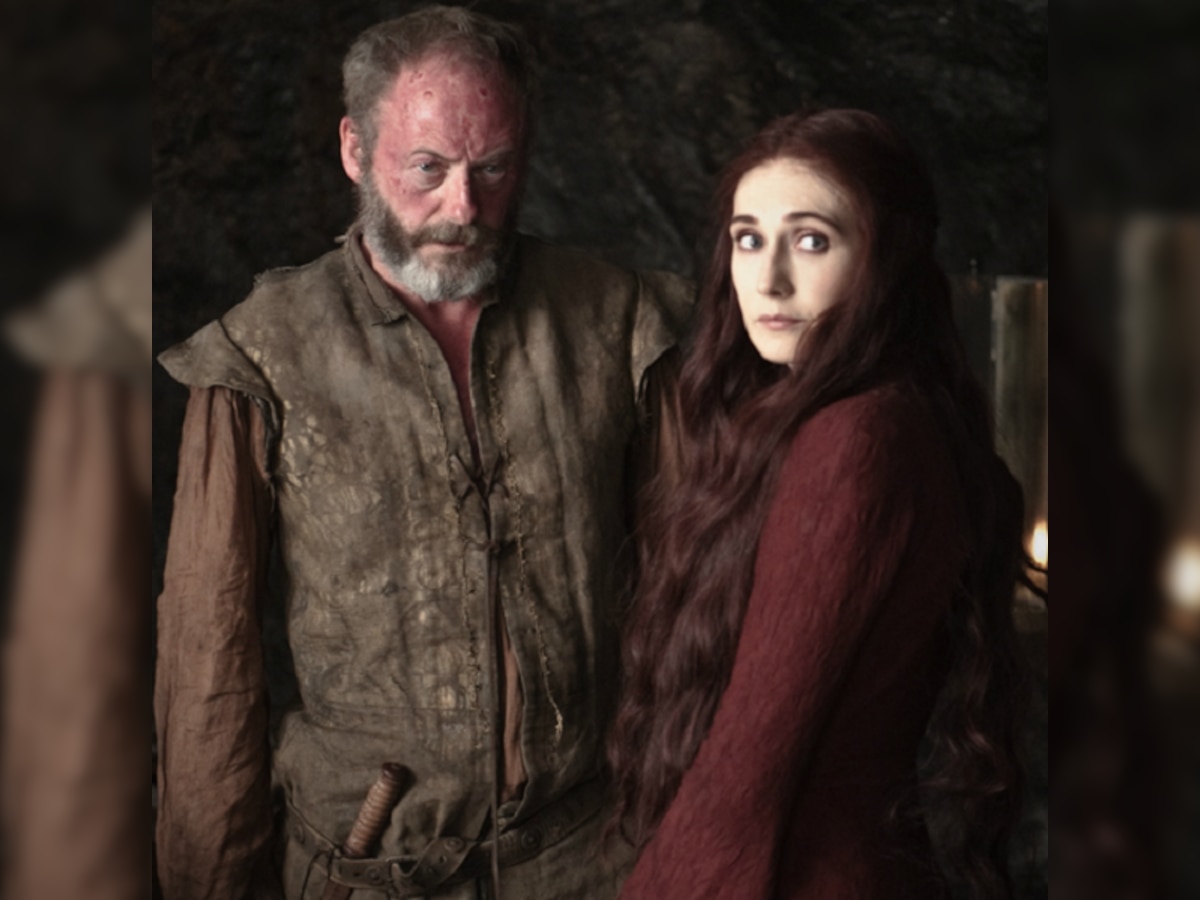 Melisandre and Ser Davos at each other