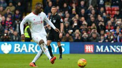 Christian Benteke's last-gasp penalty takes 10-man Liverpool to victory