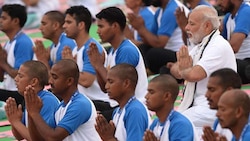 International Yoga Day: PM Modi sheds VVIP stature, sits in back row to mingle with participants
