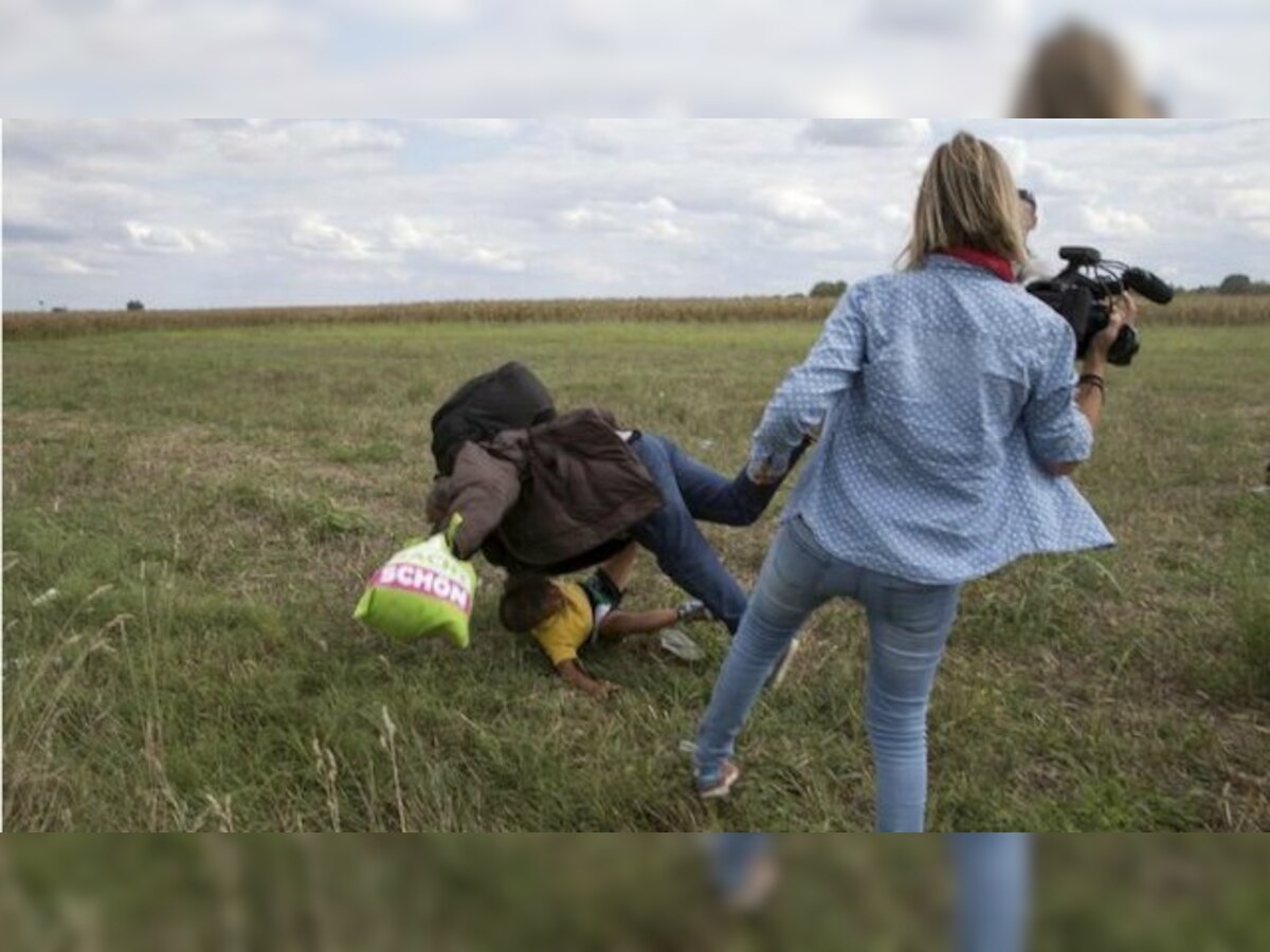 Hungary charges camerawoman accused of tripping fleeing refugees